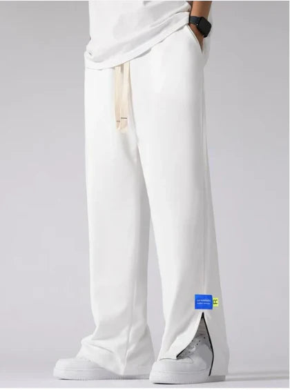 Model wearing Formova White Classic Track Pant with premium athletic streetwear design and relaxed fit